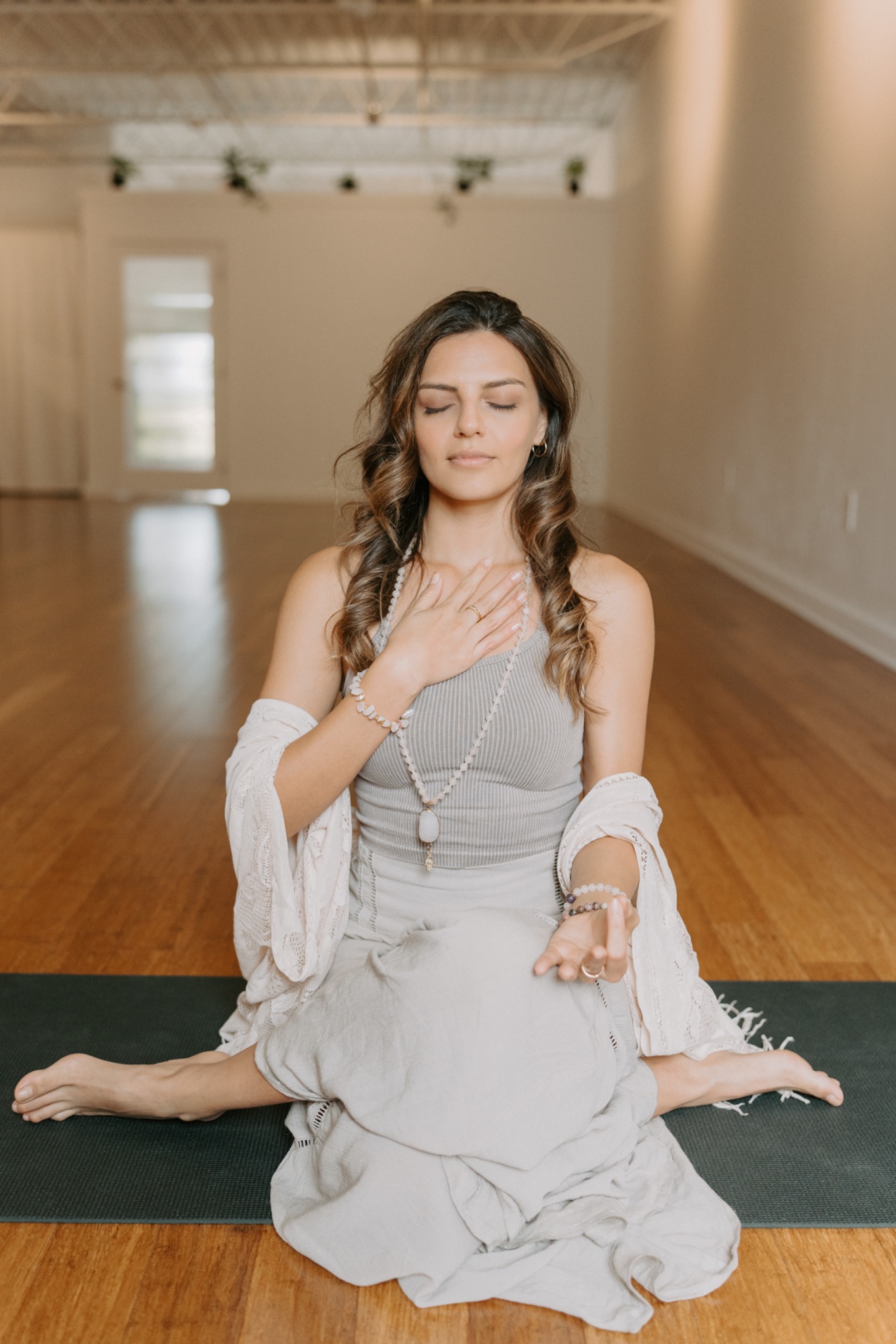 Lorena Ribero, founder of Under The Tree Mindfulness, seated in meditation